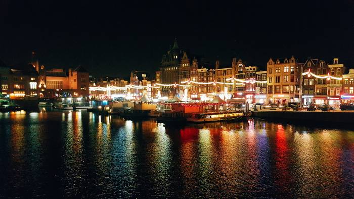 Lights illuminating the waters near Amsterdam Central Station