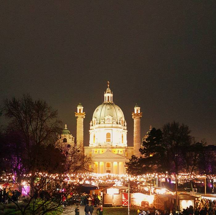 A christmas market in front of Karlskirch
