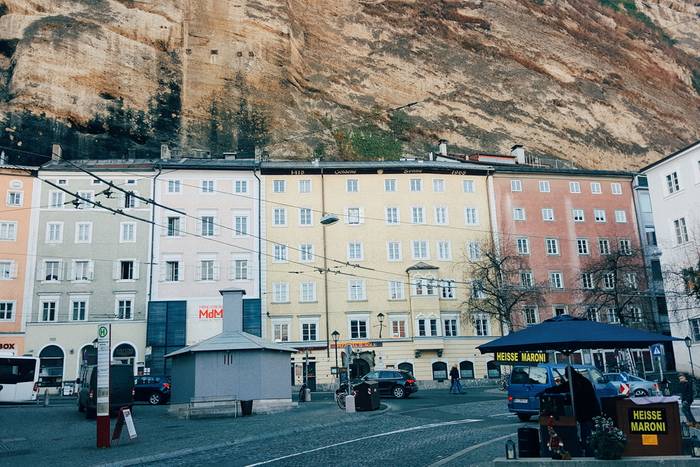 Old houses up against the sheer face of the Monchsberg mountain